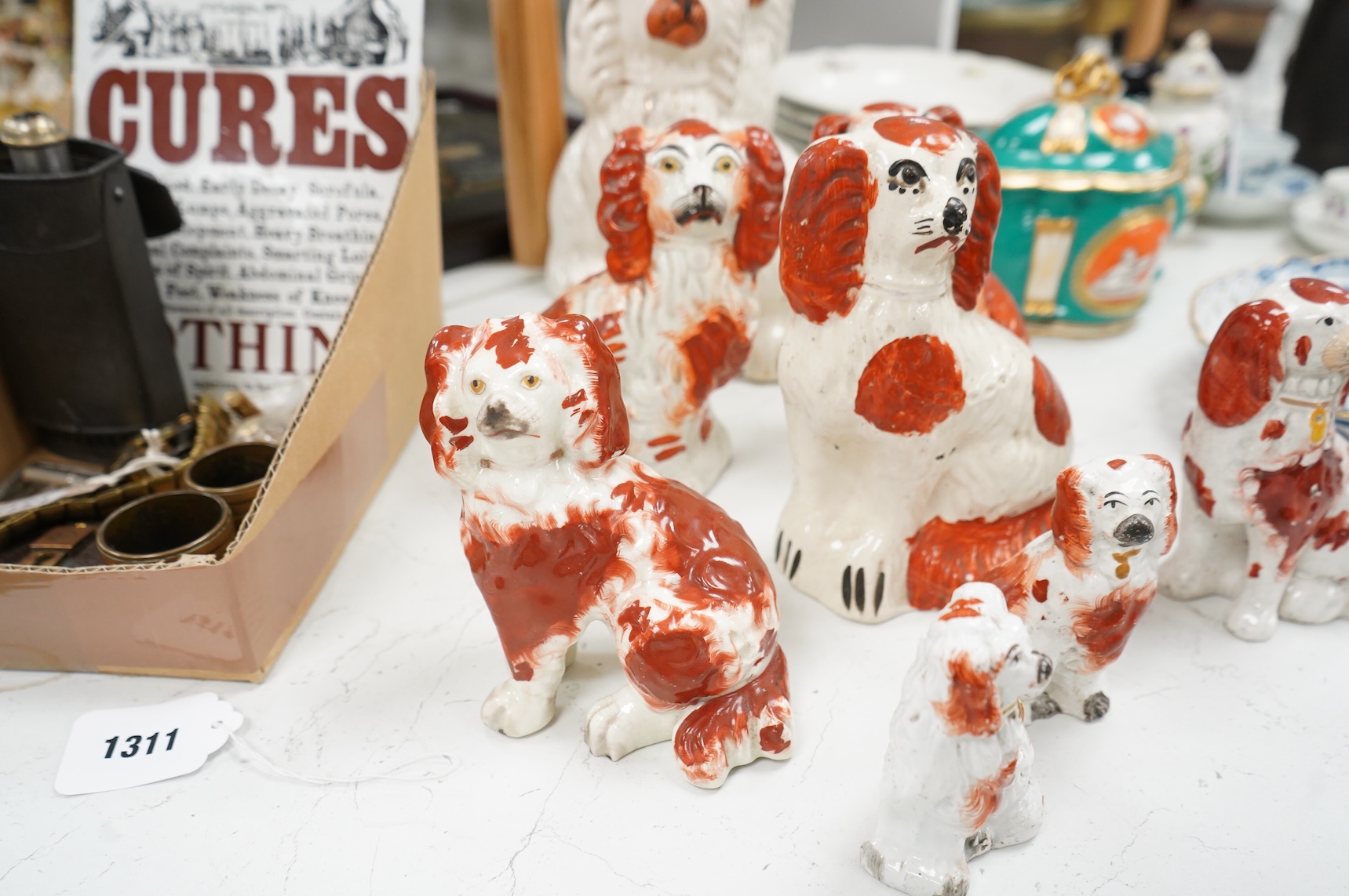 Nine different sized 19th century Staffordshire chimney dogs, tallest 23cm